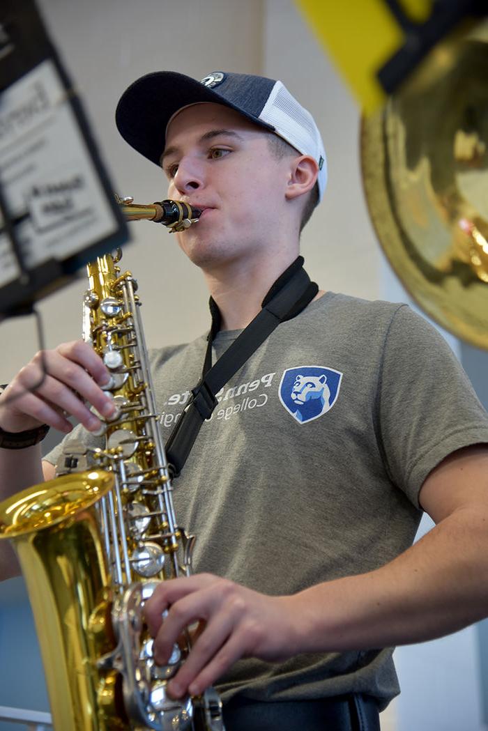 Blaine Davidson and his alto saxophone. Davidson is studying electro-mechanical engineering.